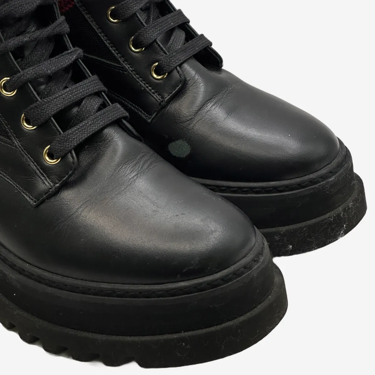 Bally women's black leather and canvas combat boots with red and white stripe detail