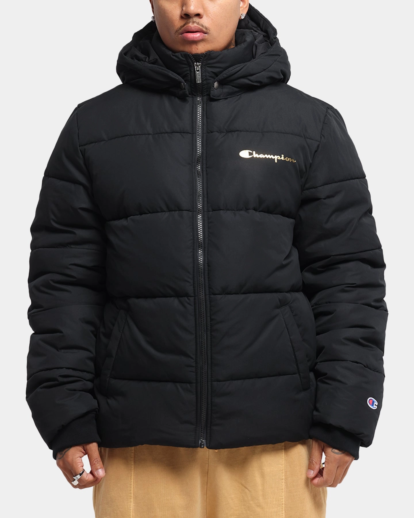 Champion Rochester Puffer Jacket Black/Gold Functional Layer sunny - day look