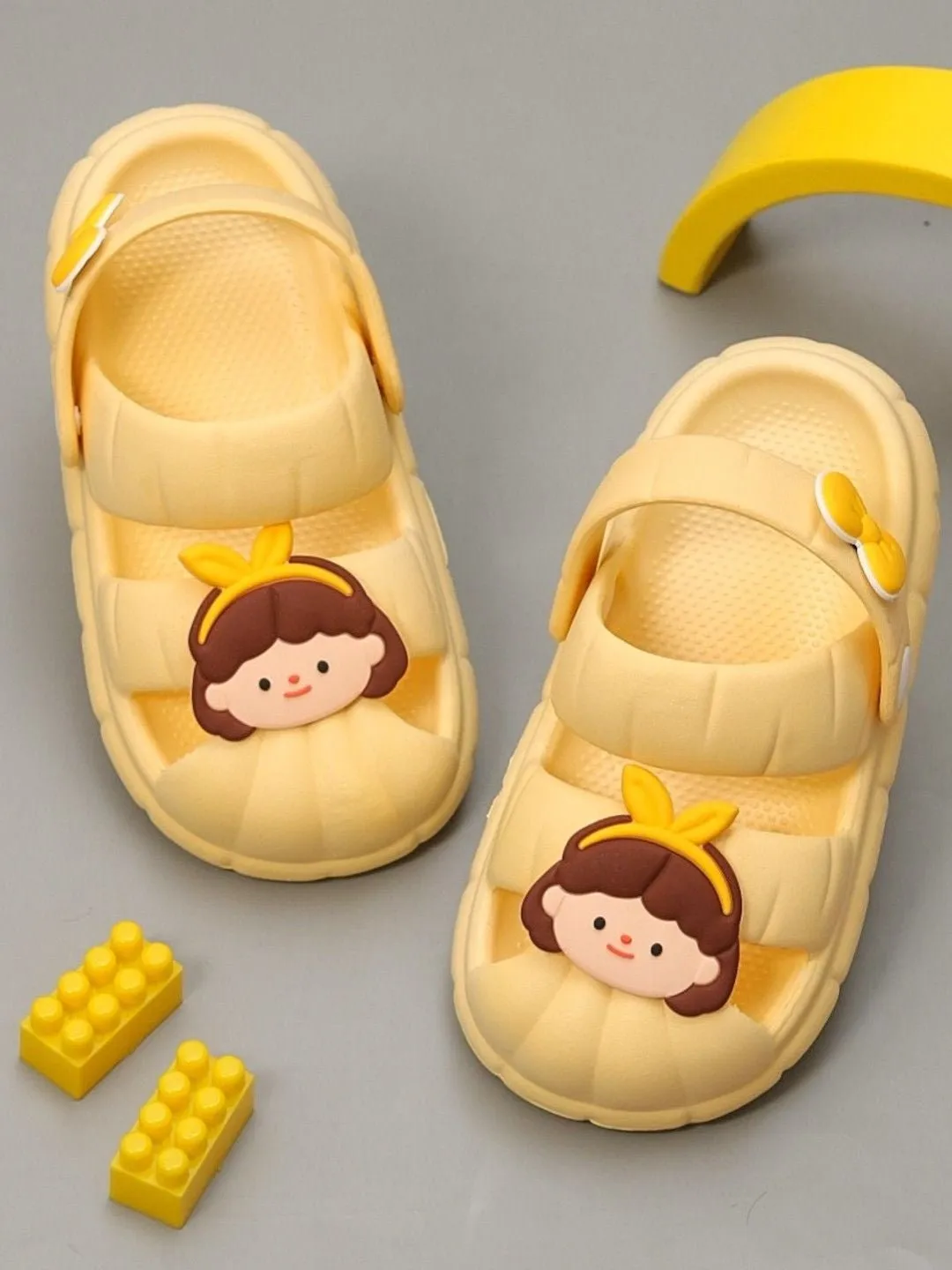 Girls' Yellow Sandals with Cute Girl Face Charms and Bow Design