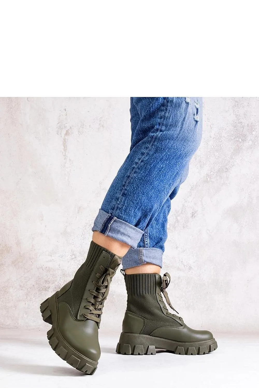 Green boots with elastic upper
