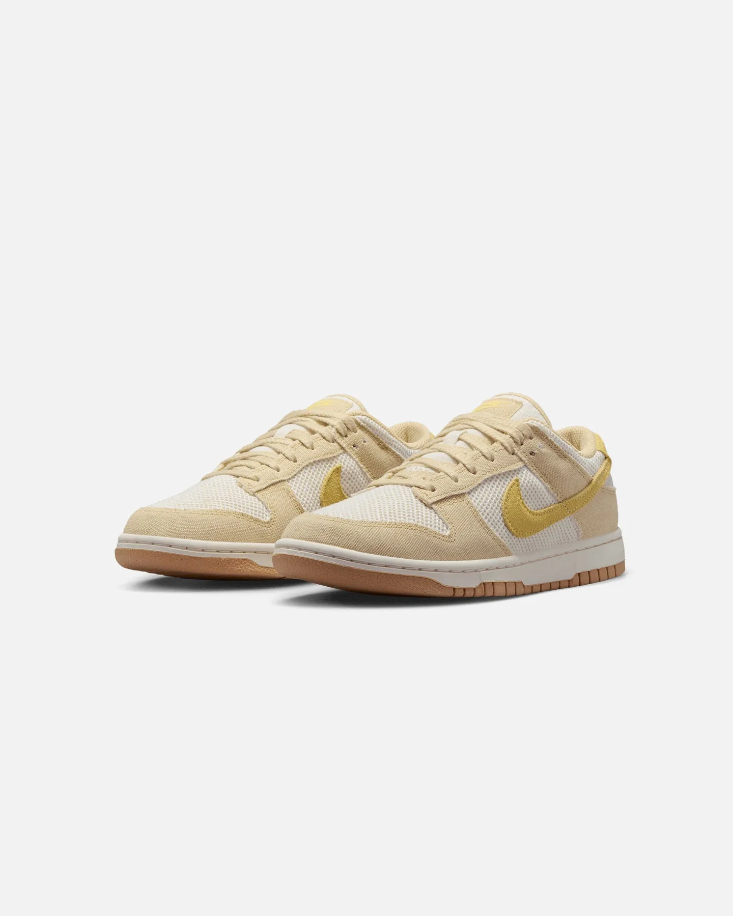 Nike Women's Dunk Low Next Nature SE "Summer" Team Gold/Soft Yellow-Pale Ivory running in park shoes