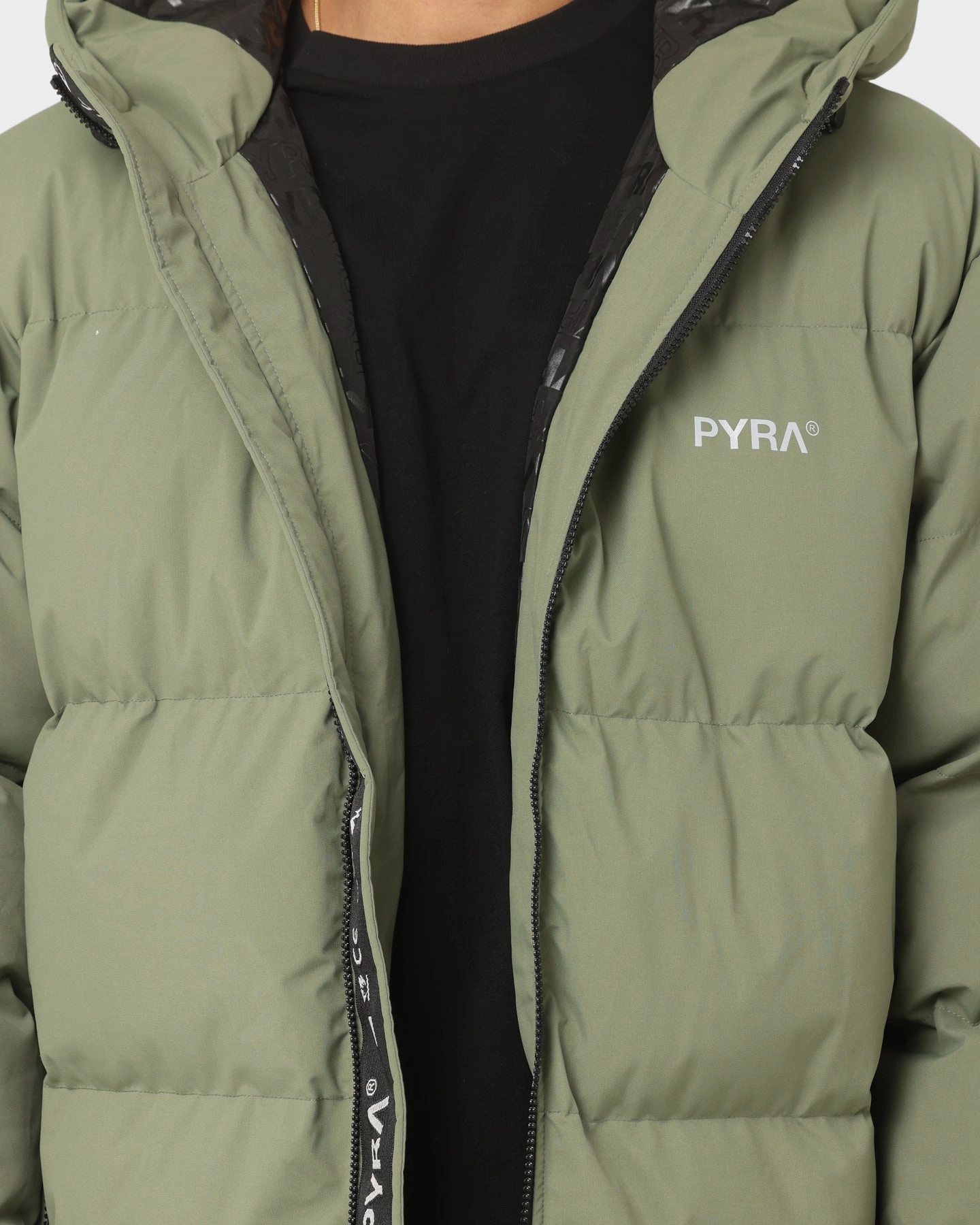 PYRA Alpine Puffa Jacket Olive Green Cold Day Demonstrate